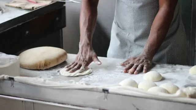 Man kneading dough