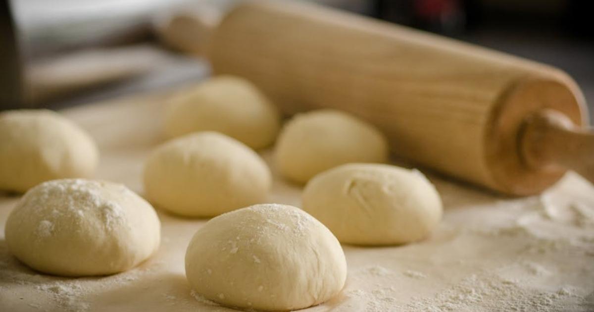 Bread dough placed on a cutting board