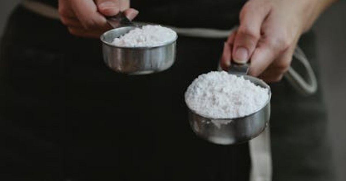 A man measuring flour